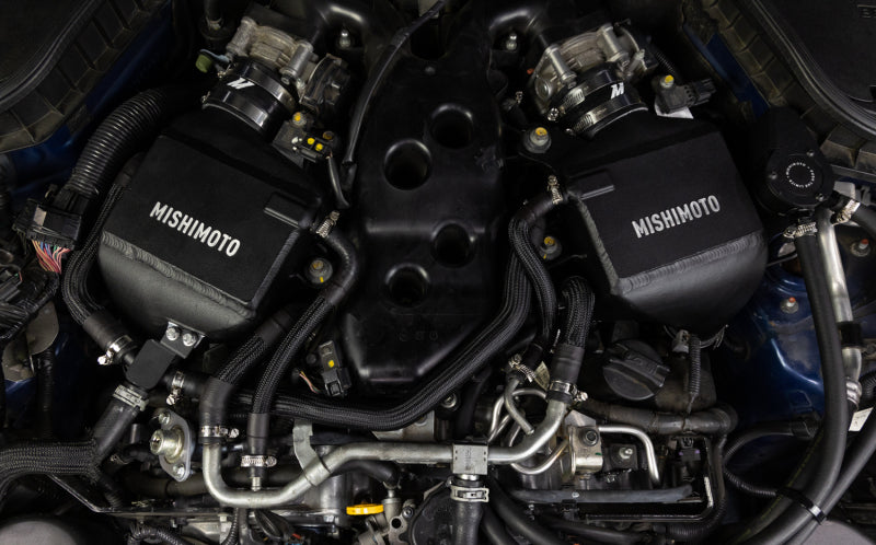 Mishimoto intercooler kit for 2016+ Infiniti Q50/60 3.0T, showing the performance air-to-water intercooler with hoses and mounting components.