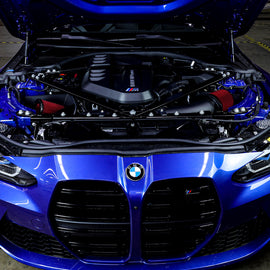 Mishimoto cold air intake for 2021+ BMW G8X M3/M4 with open airbox, showing the sleek intake tube and performance filter.