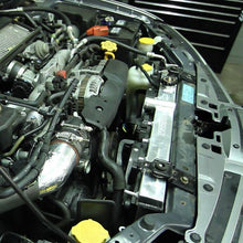 Load image into Gallery viewer, Mishimoto aluminum radiator for 2001-2007 Subaru WRX and STi, featuring a sleek metallic finish and multiple cooling fins.