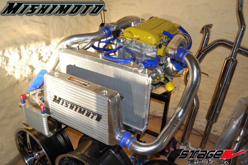 Mishimoto aluminum radiator for Nissan 240sx S14 SR20DET, featuring a sleek silver finish and multiple cooling fins.