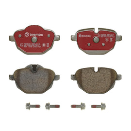 Brembo OE rear ceramic brake pads for 2019+ BMW X4, X5, and X6 SUVs, showing the brake pad set with metal backing plates.