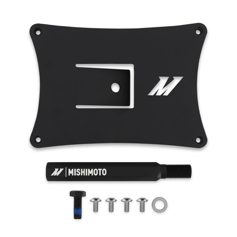 Mishimoto license plate relocation kit installed on a 2022+ Subaru WRX, showing the new mounting position on the front bumper.