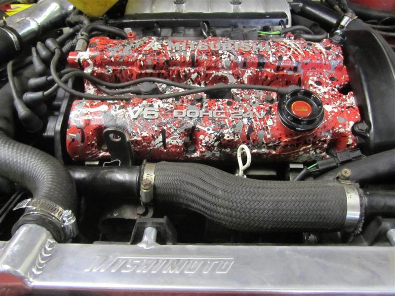 Mishimoto aluminum radiator for 1991-1999 Mitsubishi 3000GT Turbo, showing the sleek silver radiator core and mounting points.