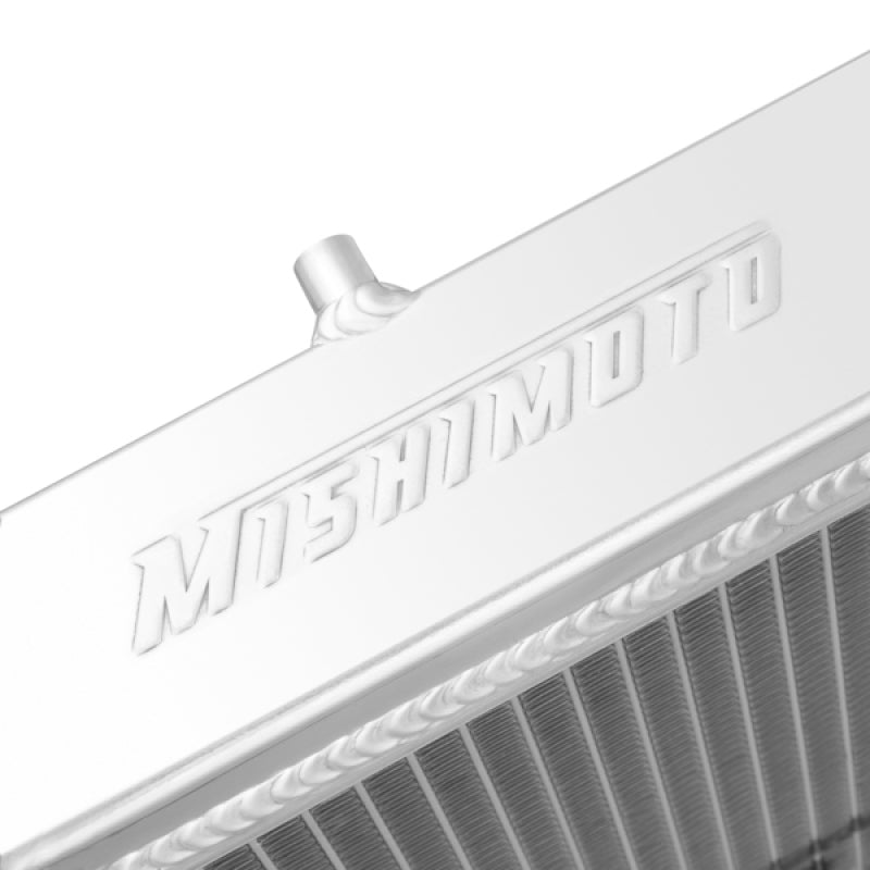Mishimoto aluminum radiator for 1991-1999 Mitsubishi 3000GT Turbo, front view showing sleek metal construction and cooling fins.