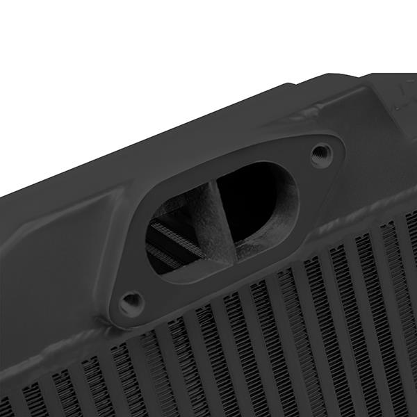 Mishimoto Subaru WRX STi 08-15 top-mount intercooler kit with black powder-coated intercooler and hoses, installed on engine.