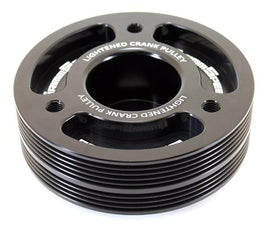 Black GrimmSpeed lightweight crank pulley for Subaru, underdrive design, compatible with crankshaft, enhances engine performance.