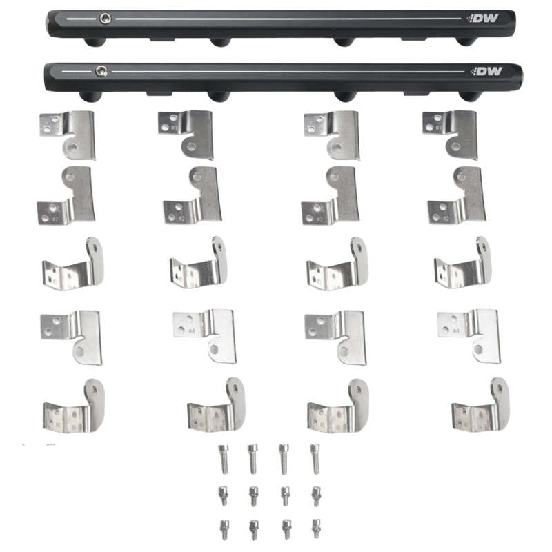 DeatschWerks GM Truck Gen 3 and 4 LS fuel rails installed in a vehicle engine, showing the sleek metal design and mounting points.