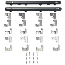 Load image into Gallery viewer, DeatschWerks GM Truck Gen 3 and 4 LS fuel rails installed in a vehicle engine, showing the sleek metal design and mounting points.