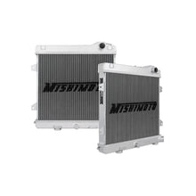 Load image into Gallery viewer, Mishimoto aluminum radiator for 87-91 BMW E30 M3 with manual transmission, featuring a sleek silver finish and core design.