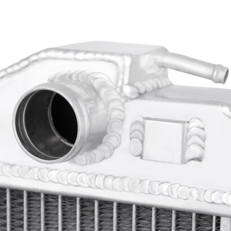 Mishimoto aluminum radiator for 1987-1991 BMW E30 M3 with manual transmission, shown with cooling fins and inlet/outlet connections.