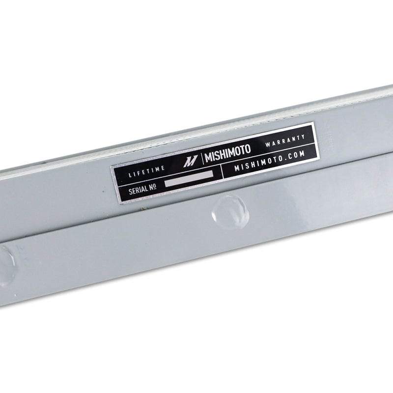 Mishimoto silver oil cooler for 2021+ BMW G8X M3 and M4, showing the sleek metal fins and mounting connections.
