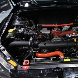Mishimoto cold air intake kit for 2008+ Subaru WRX/STi in wrinkle black, showing the intake pipe and filter assembly.
