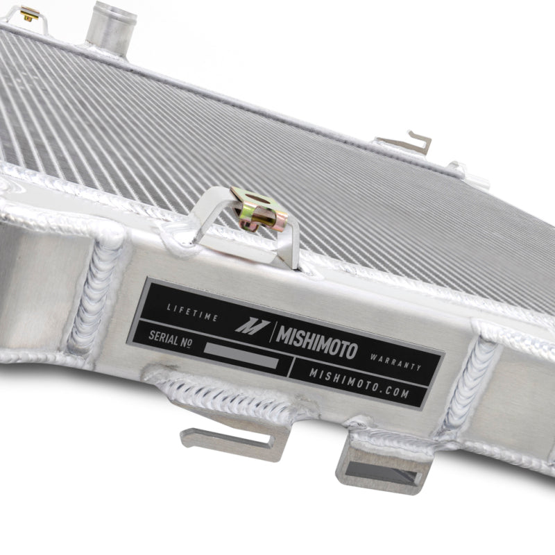 Mishimoto 2024+ Ford Mustang V8/2.3L aluminum radiator, performance cooling system, installed in engine bay, close-up view