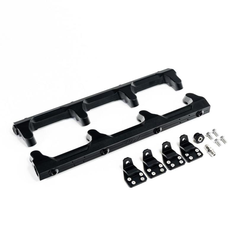 DeatschWerks Chevrolet LSA/LS9 fuel rails, metal engine components with mounting points and fuel line connections.