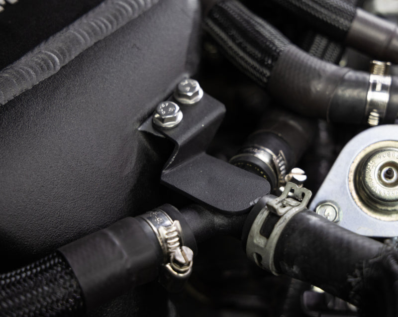 Mishimoto intercooler kit for 2016+ Infiniti Q50 and Q60 3.0T, showing the performance air-to-water intercooler installed on a vehicle