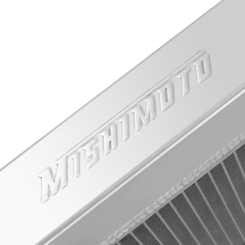 Mishimoto aluminum radiator for BMW E30 M3 87-91 manual transmission, featuring sleek silver design and cooling fins.