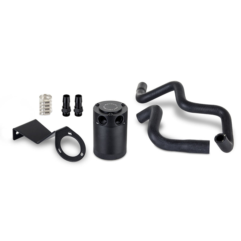 Mishimoto baffled oil catch can kit installed in a 2022+ Subaru BRZ or Toyota GR86, showing the black catch can with hoses attached.