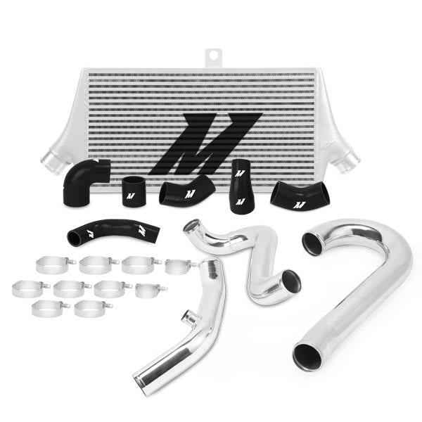Mishimoto Subaru 08-15 WRX STI top-mount intercooler kit with powder-coated black finish and black hoses, mounted in engine bay.