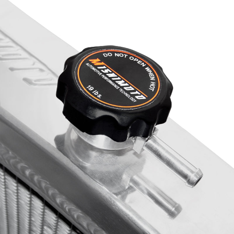 Mishimoto aluminum radiator for 1995-1998 Nissan 240sx S14 SR20DET engine, showing the sleek, polished radiator core and fittings.