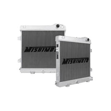 Load image into Gallery viewer, Mishimoto aluminum radiator for BMW E30 M3, 1987-1991, with dual core design and mounting brackets, in a car engine bay.
