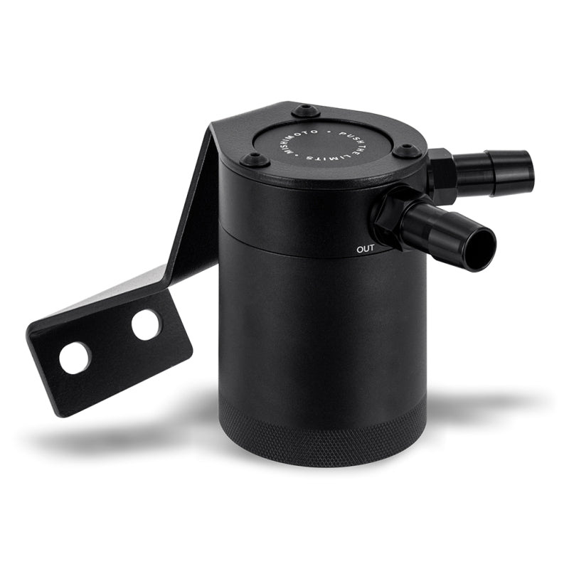 Mishimoto baffled oil catch can kit installed in a 2022+ Subaru BRZ or Toyota GR86 engine bay, showing the black catch can and hoses.