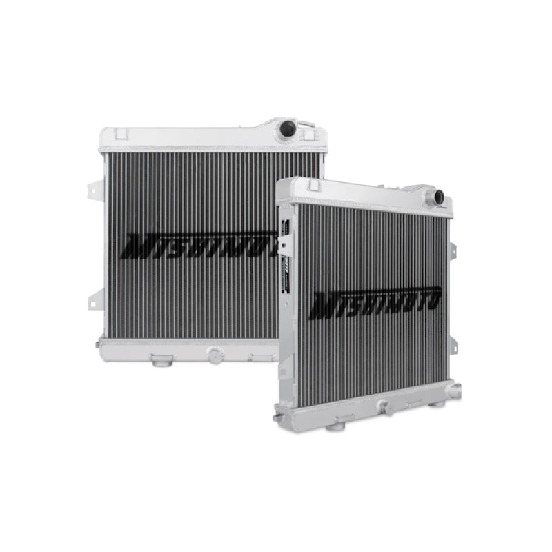 Mishimoto aluminum radiator for BMW E30 M3 87-91, showing sleek design and mounting points on a black background