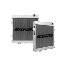 Load image into Gallery viewer, Mishimoto aluminum radiator for BMW E30 M3 87-91, showing sleek design and mounting points on a black background