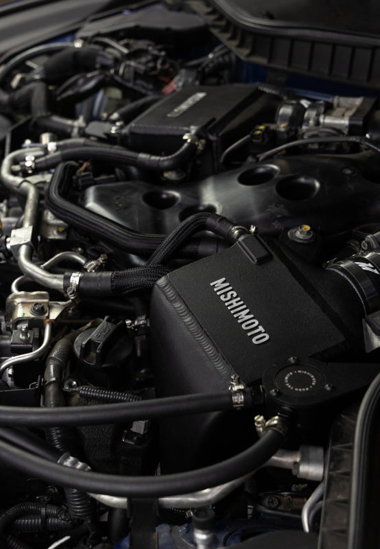 Mishimoto intercooler kit for 2016+ Infiniti Q50 and Q60 3.0T, showing the aluminum intercooler core and piping components.