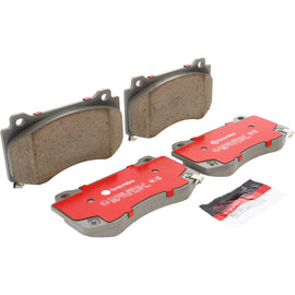 Brembo OE ceramic brake pads for 2007+ Dodge Challenger and 2005-2010 Dodge Charger front brake system, shown in the image.